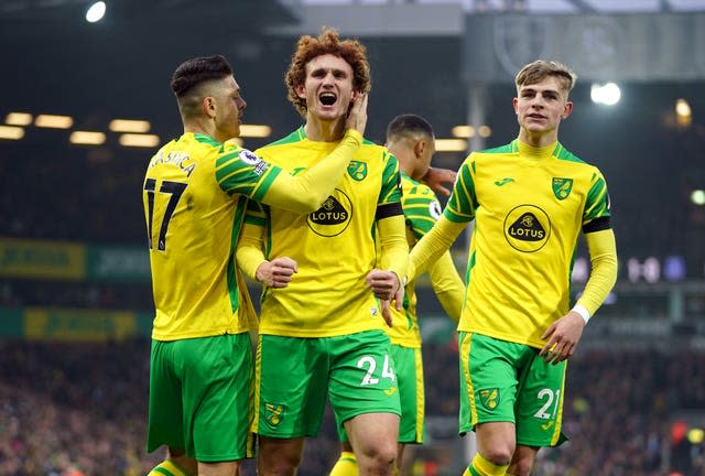 Norwich's Milot Rashica, Josh Sargent and Brandon Williams celebrate an own goal by Everton’s Michael Keane