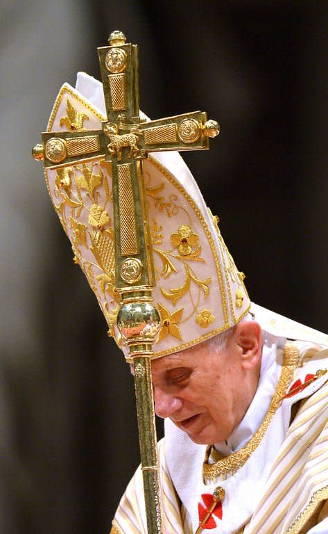 Pope Benedict XVI celebrates Christmas Eve mass at St. Peter's Basilica in Vatican City on December 24, 2012. Pope Benedict XVI said in his Christmas Eve mass that religion can be corrupted, leading to violence and wars, but refuted critics who claim that denying God's existence would lead to peace