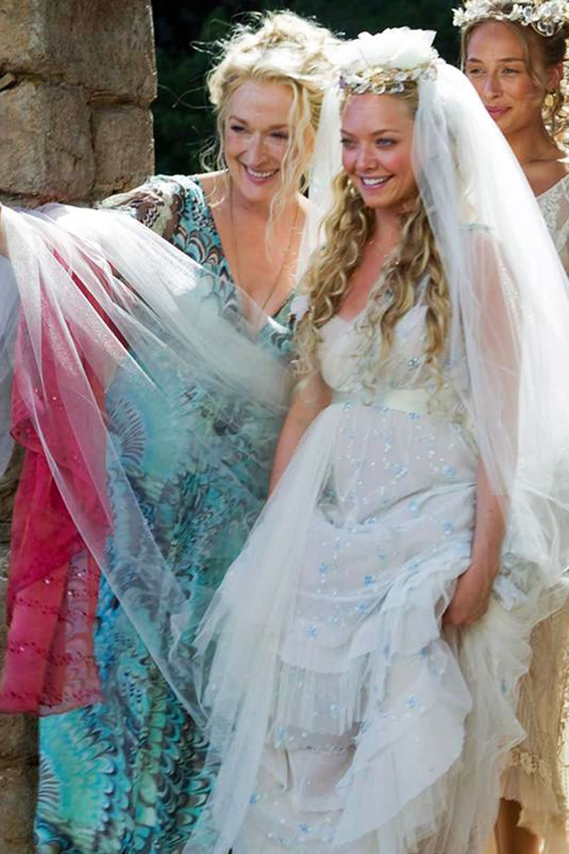 <p>What dress is fit for a Grecian island wedding? Naturally, that would be the empire-waist, tulle, and blue-beaded bohemian wedding gown Amanda Seyfried wore as Sophie.<br></p>