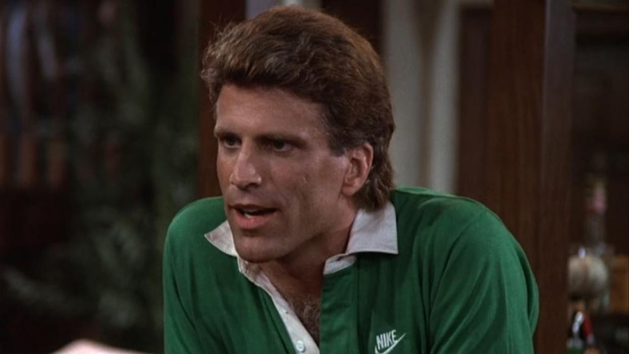  A screenshot of Ted Danson leaning against the bar in Cheers. 