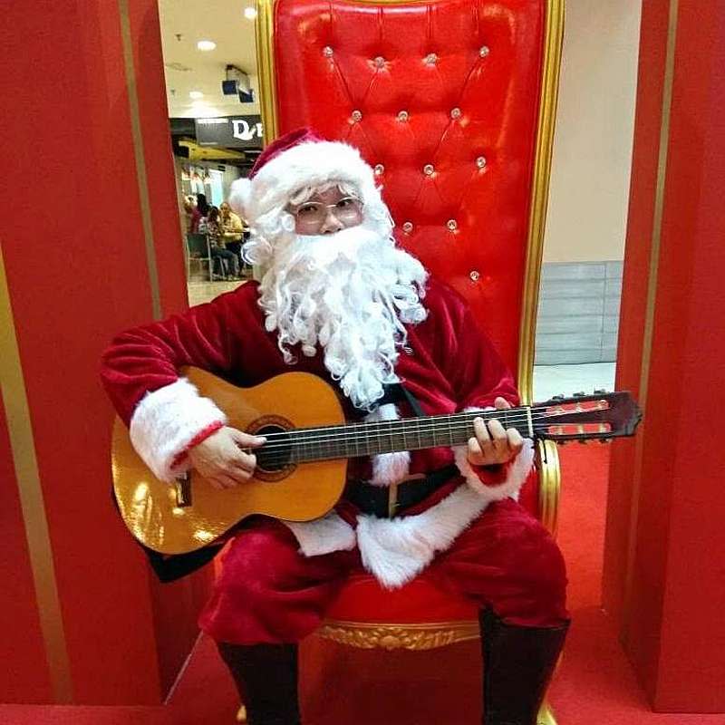 During performances as Santa in previous years, Yap would use musical instruments to enhance his Santa character. — Picture courtesy of Alex Yap