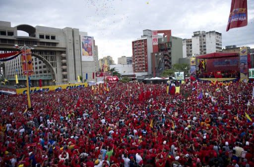 Supporters of Venezuelan President Hugo Chavez attend a massive rally after he registered his candidacy in the National Electoral Center for the upcoming presidential election, in Caracas on June 11, 2012