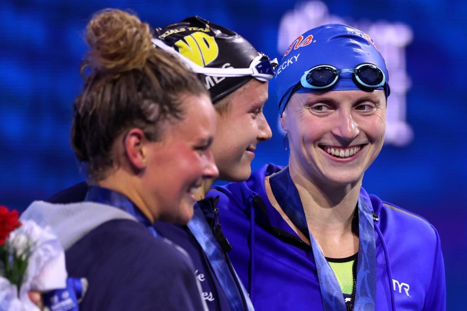 INDIANAPOLIS, INDIANA - JULY 01: Katie Ledecky smiles at Katie Grimes after winning the Women's 1500m Freestyle final on day five of the Phillips 66 National Championships at Indiana University Natatorium on July 01, 2023 in Indianapolis, Indiana.