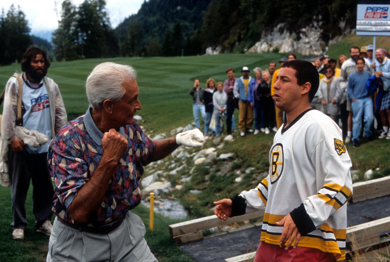 Bob Barker prepares to punch Adam Sandler in a scene from the film 'Happy Gilmore', 1996. (Photo by Universal/Getty Images)