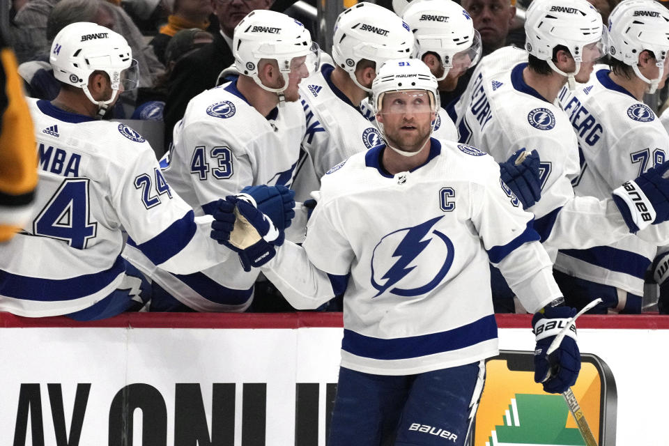 FILE - Tampa Bay Lightning's Steven Stamkos (91) returns to the bench after scoring during the second period of an NHL hockey game against the Pittsburgh Penguins in Pittsburgh, Saturday, April 6, 2024. The Nashville Predators made a big splash in the opening minutes of NHL free agency by signing Steven Stamkos, Jonathan Marchessault and Brady Skjei. (AP Photo/Gene J. Puskar, File)