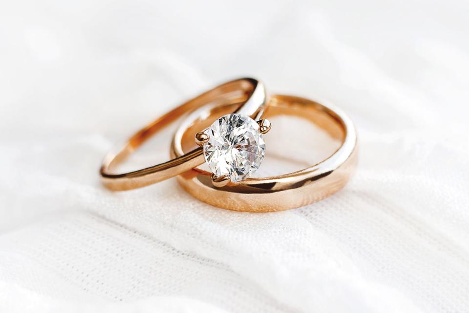 <p>Getty</p> Stock image of diamond engagement ring and wedding band