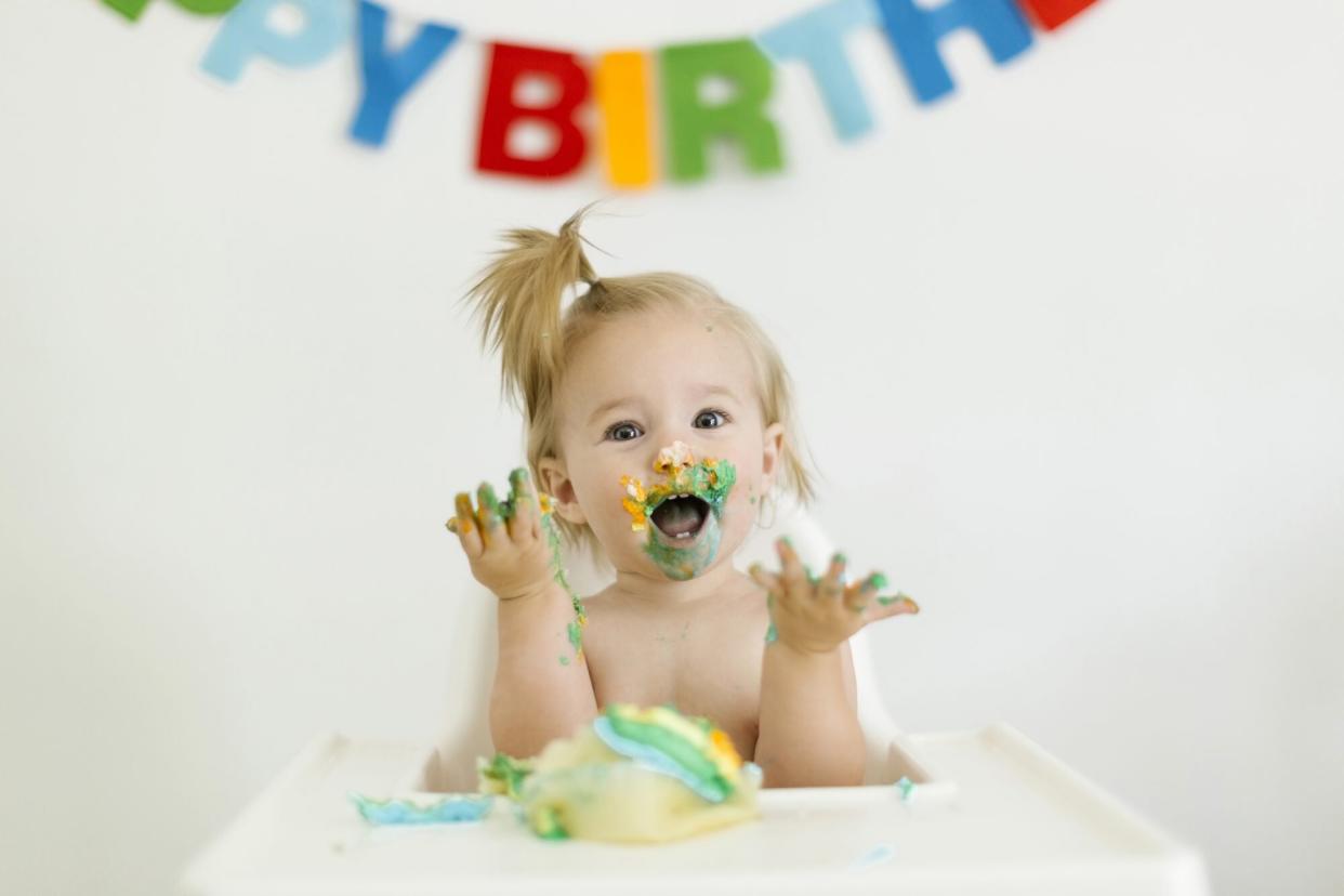 Baby Girl Eating Birthday Cake