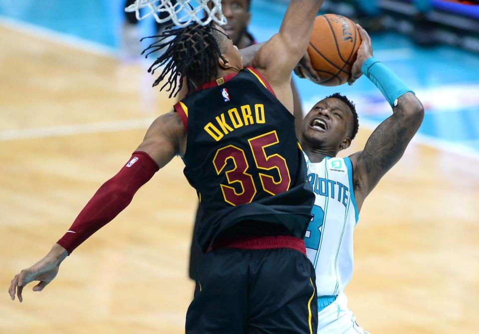 Charlotte Hornets guard Terry Rozier, right, fights to get a shot off Wednesday against Cleveland guard Isaac Okoro. Rozier led Charlotte with 22 points in the loss and said afterward his team’s offense was currently too “predictable.”