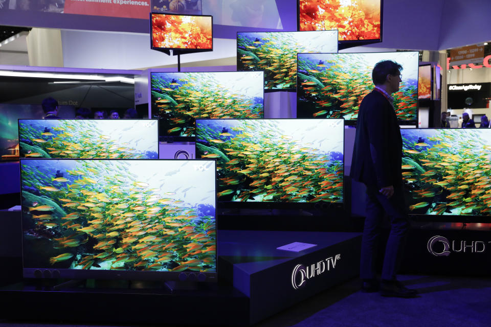 QUHD TVs are on display at the TCL booth during CES International, Thursday, Jan. 5, 2017, in Las Vegas. (AP Photo/John Locher)