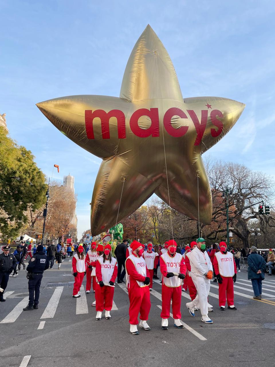 Attendants hold the Macy’s Star balloon at the start of the Macy’s Thanksgiving Day Parade route. Sixteen Oklahoma cheerleaders participated in Thursday’s parade.