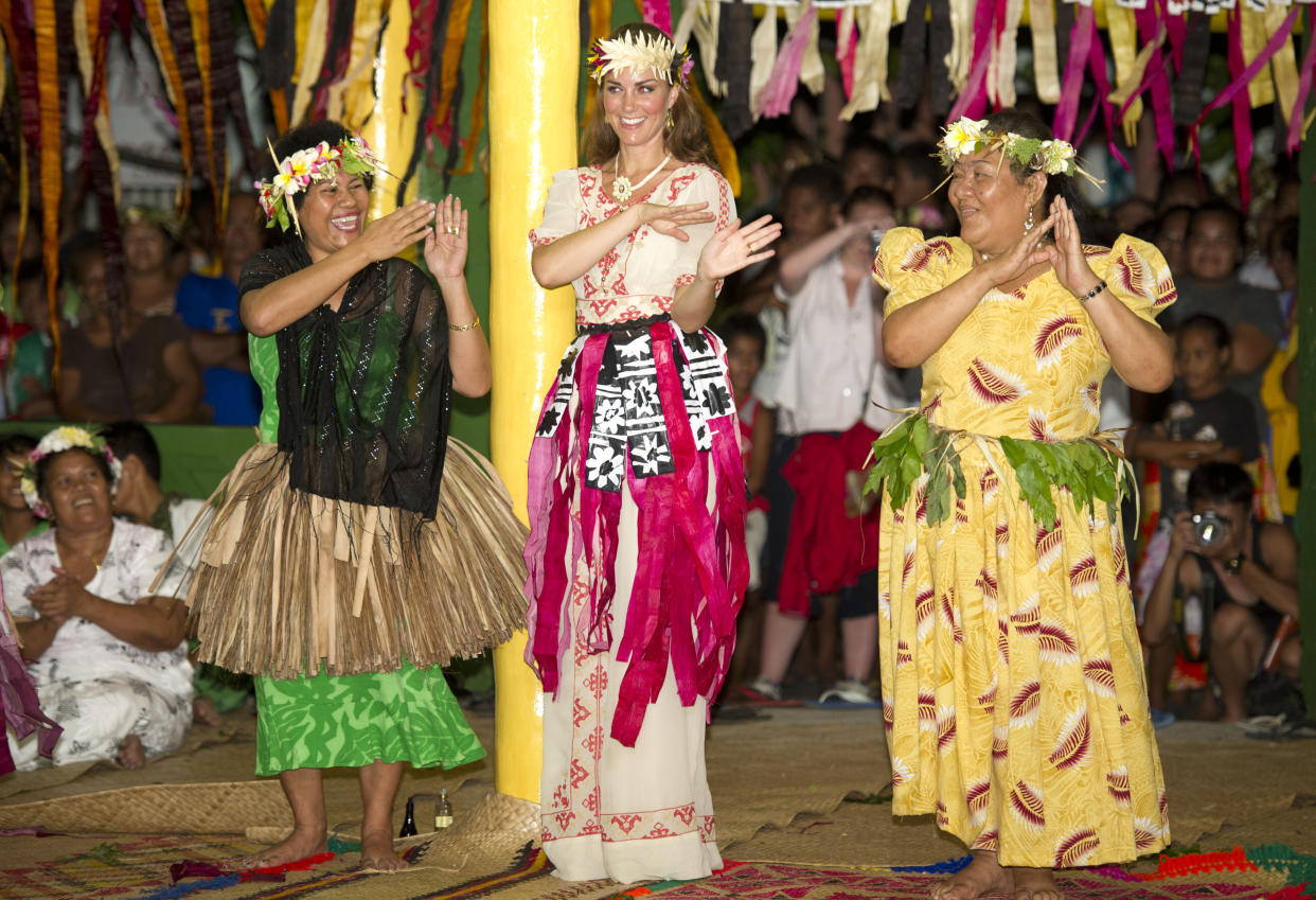 The Duchess of Cambridge dances with locals at Vaiaku Falekaupule during a visit to Tuvalu, Solomon Islands, during a nine-day royal tour of the Far East and South Pacific in honour of the Queen's Diamond Jubilee.