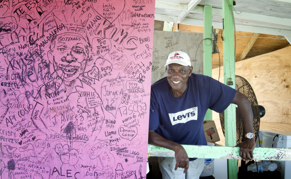 In this Sept. 11, 2013 photo, Joseph Roberts, a commercial fisherman and proprietor of Joe’s Conch Shack, poses for a photo in Bimini, Bahamas. Changes are coming fast to Bimini. Malaysia-based Genting Group is spending at least $300 million on Resorts World Bimini, bringing economic benefits but also an uneasiness about what may happen to the delicate ecosystem and to Bimini’s identity as a sport fishing capital of the world. “I’ve got three grandsons and I hope that one day one or two of them could be fishermen ... and make a decent living,” Roberts said. “What are they going to have if you destroy everything?” (AP Photo/J Pat Carter)