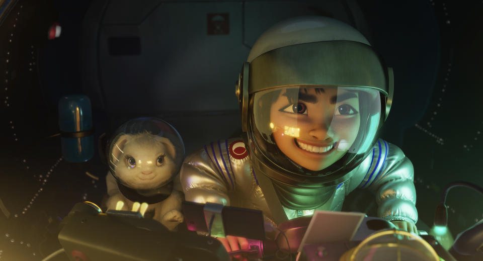 This image released by Netflix shows characters Bungee the rabbit, left, and Fei Fei, voiced by Cathy Ang, in a scene from "Over the Moon." (Netflix via AP)