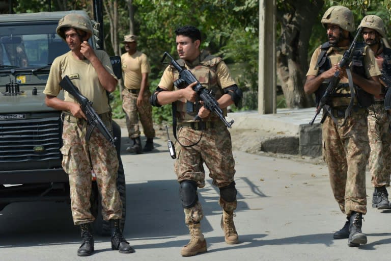 Pakistani soldiers cordon off a street leading to a Christian colony following an attempted suicide attack on the outskirts of Peshawar on September 2, 2016