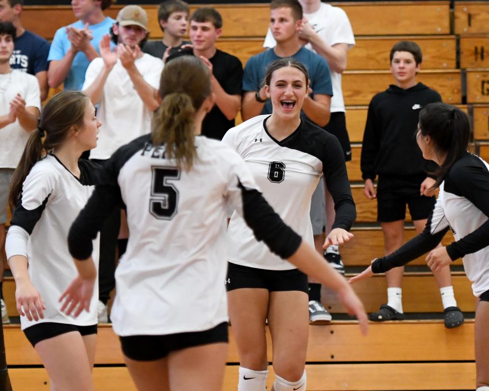 Perry Girls Volleyball celebrates a point against Green at Perry.   Tuesday, Sept 19, 2023.