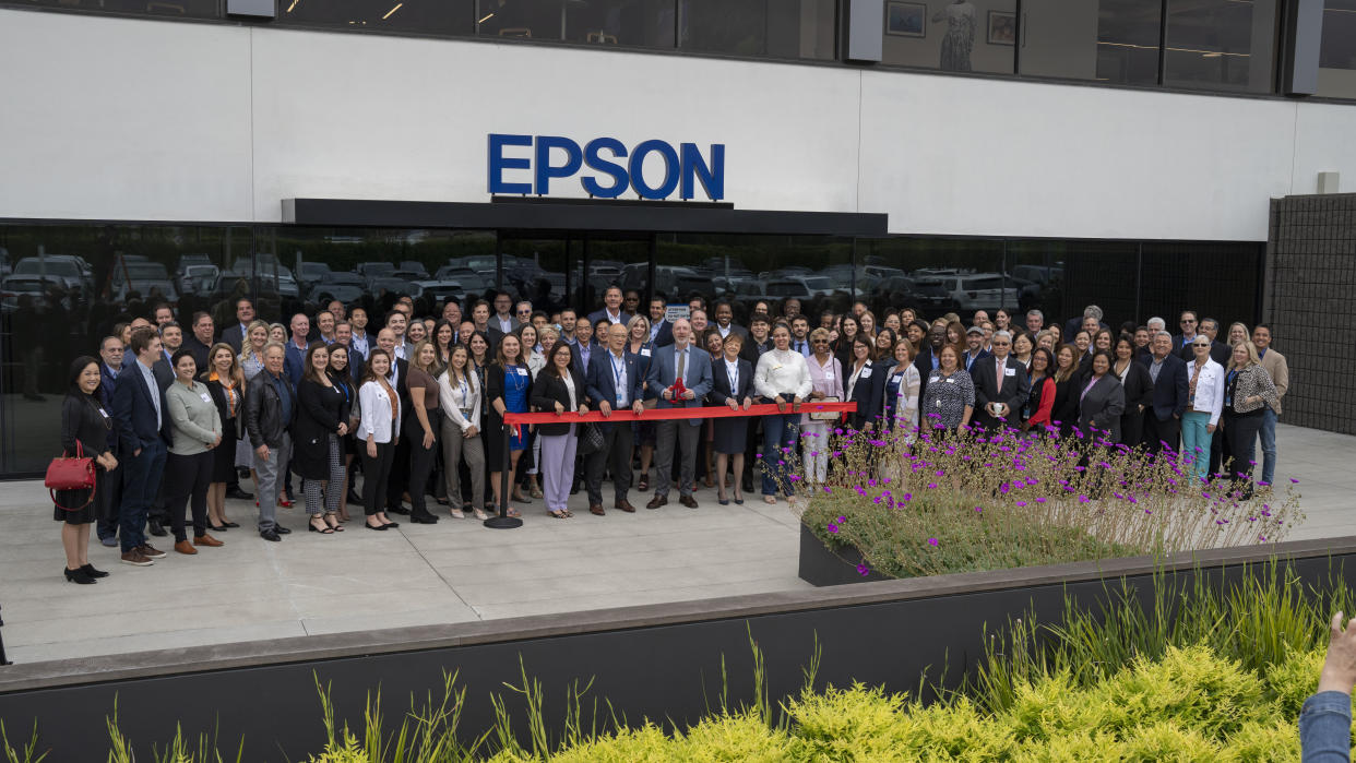  The Epson team stands in front of the new Los Alamitos HQ to cut the ribbon. 