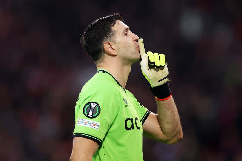 Aston Villa goalkeeper Emiliano Martinez reacts after saving a Lille penalty