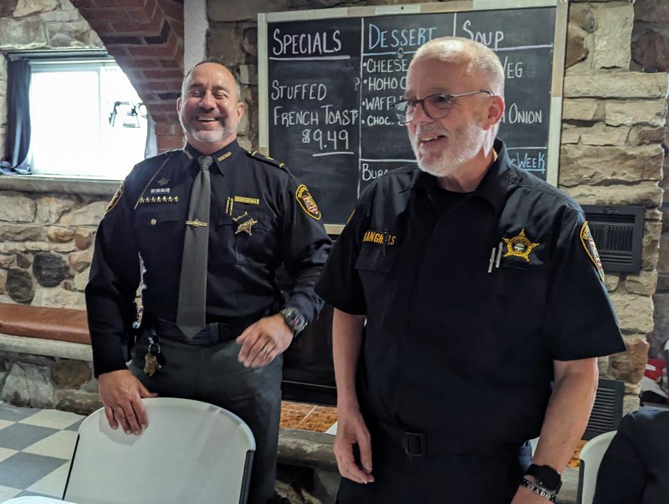 Ottawa County Sheriff Stephen Levorchick, left, stands with Deputy Phil Langhals at the Port Clinton Kiwanis Law Enforcement Awards ceremony on Wednesday.