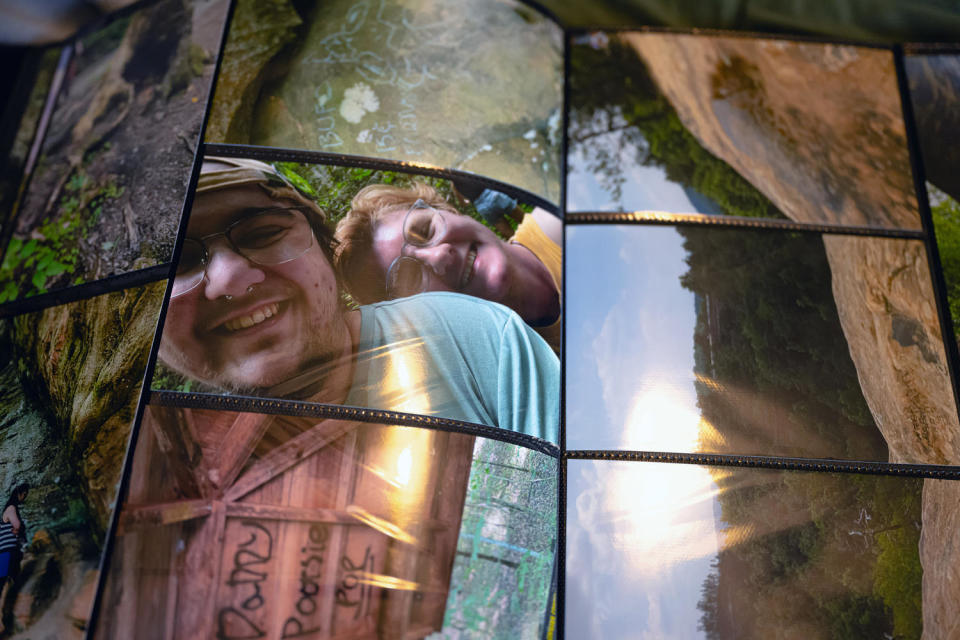 A photograph of Oliver Bertasio and his boyfriend, Adrian Whittamore, is seen in a family album (Jon Cherry for NBC News)