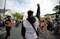 Protesters gather at the scene where Floyd was pinned down by a police officer in Minneapolis