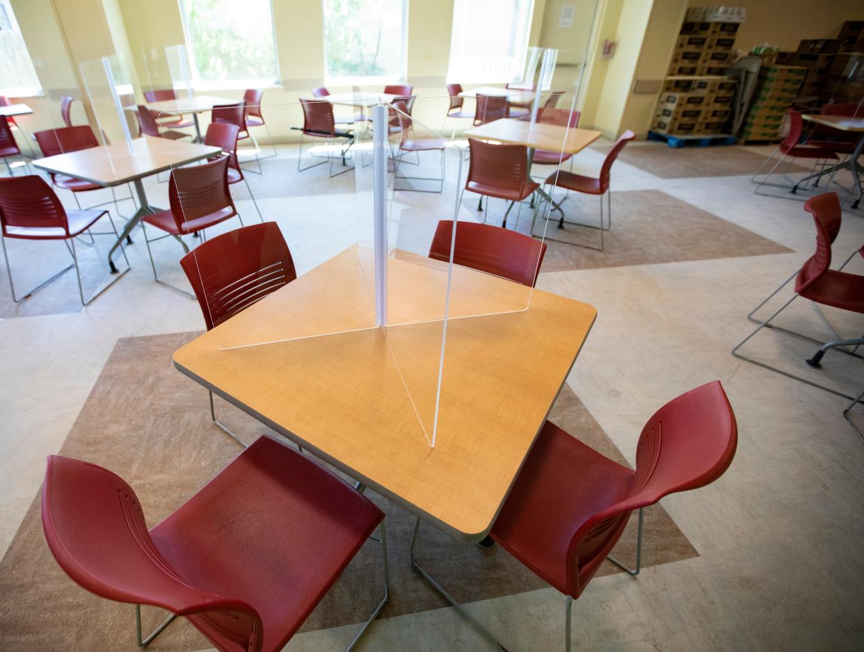 Plexiglass partitions are placed on each of the tables in the dining room at the Kearney Center to prevent the spread of COVID-19. 