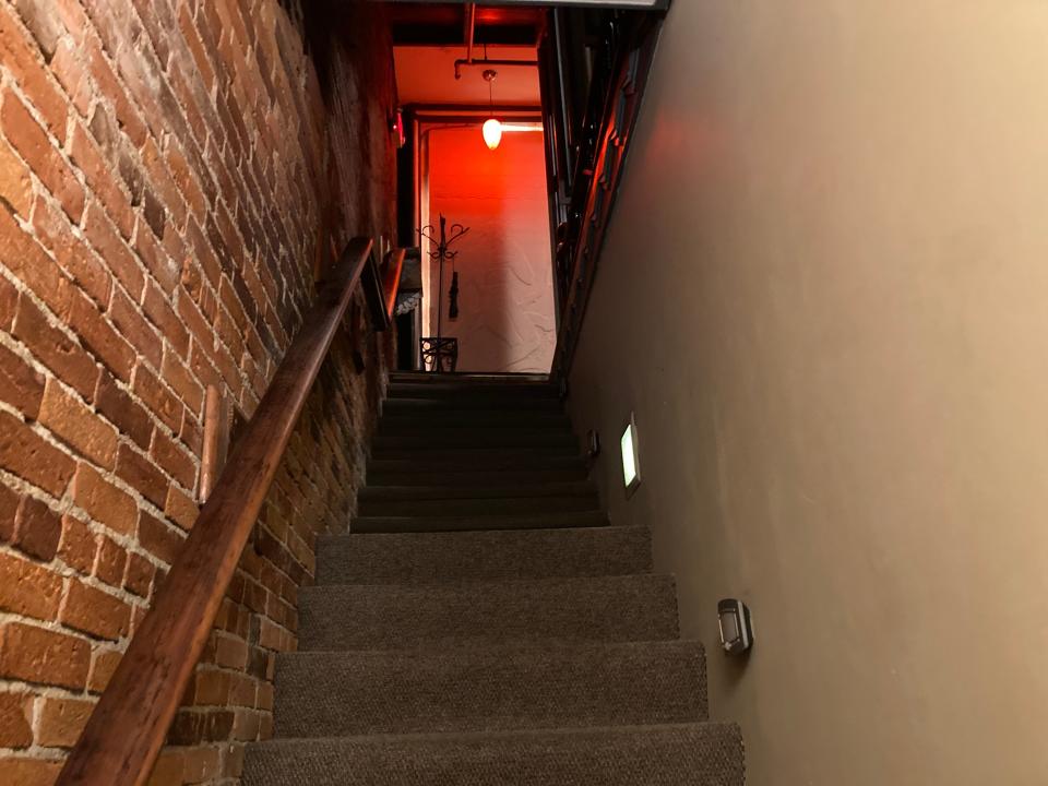 The stairway that leads to the second-floor dining room at Hugo's Bar & Grill in Montpelier, shown Nov. 28, 2023.