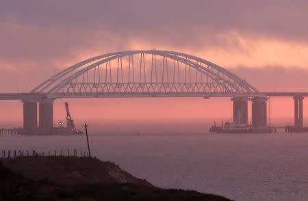 A general view shows a road-and-rail bridge, which is constructed to connect the Russian mainland with the Crimean peninsula, at sunrise in the Kerch Strait, Crimea November 26, 2018. REUTERS/Pavel Rebrov
