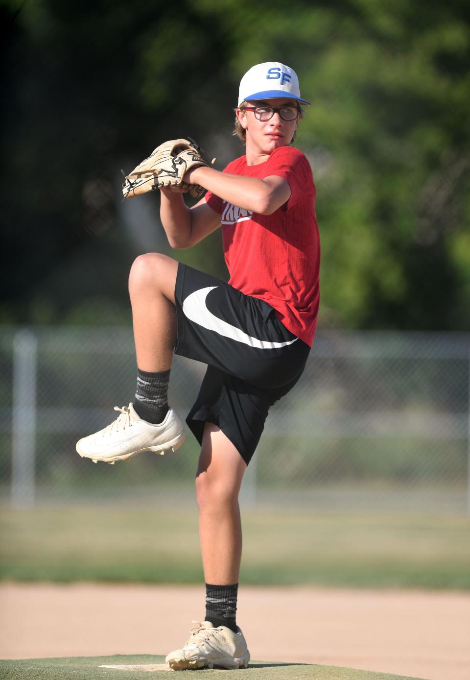 Evin Edwards (#44) winds up to pitch during Little League practice on Monday, August 1, 2022, at Cherry Rock Park in Sioux Falls.