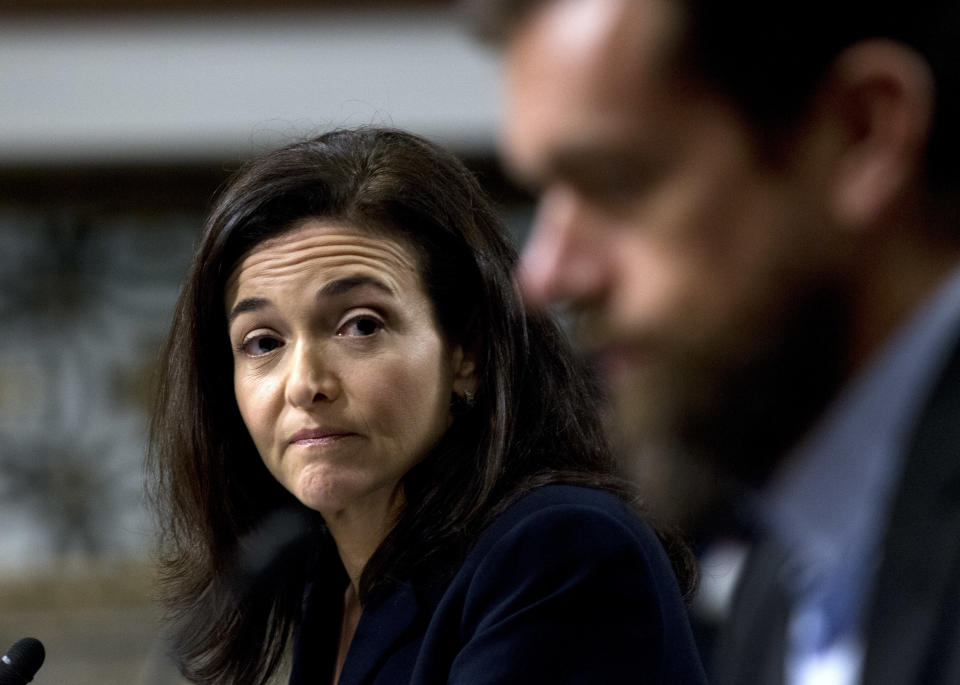Facebook COO Sheryl Sandberg accompanied by Twitter CEO Jack Dorsey, right, before the Senate Intelligence Committee hearing on 'Foreign Influence Operations and Their Use of Social Media Platforms' on Capitol Hill, Wednesday, Sept. 5, 2018, in Washington. Google CEO did not show for the hearing. (AP Photo/Jose Luis Magana)
