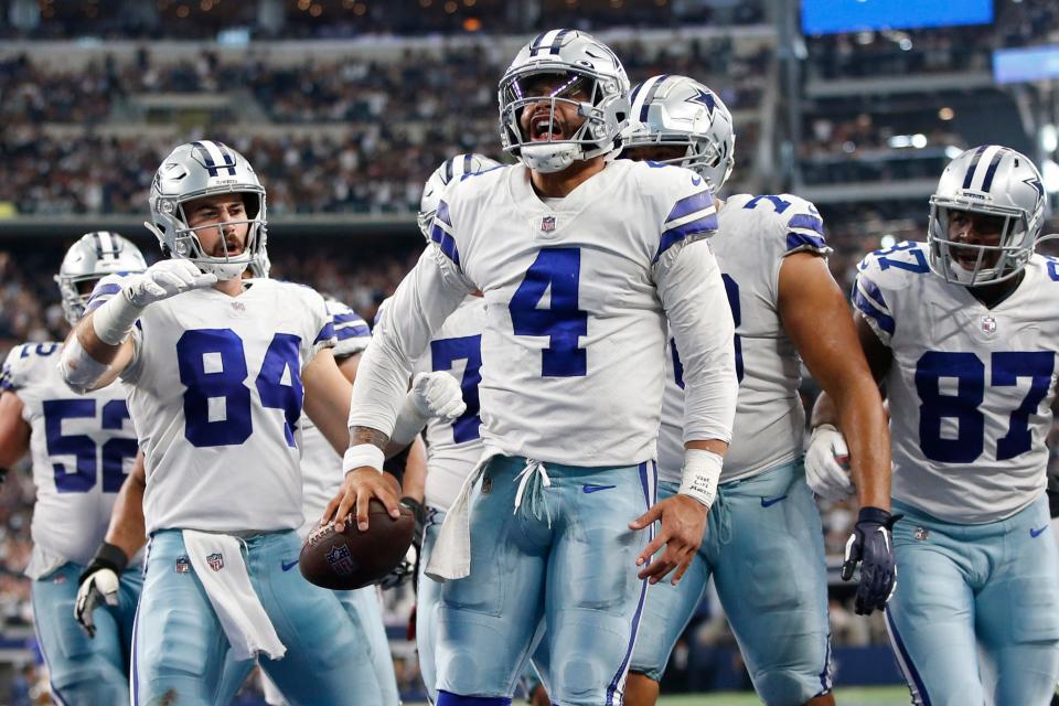 QB Dak Prescott (4) and the Cowboys clinched a playoff berth from their couches Thursday night thanks to the 49ers' loss.