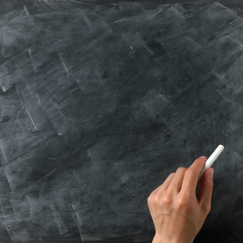 a blank blackboard and chalk ready for your copy or text with hand