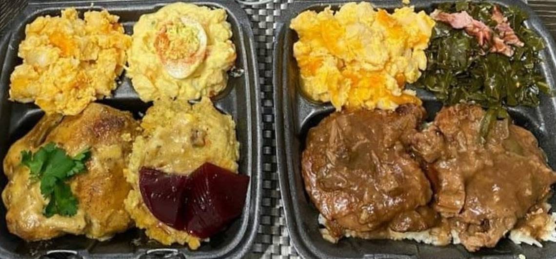 From left to right, a to-go plate from the Hen’s Nest of Cornish hens, cornbread dressing with cranberry sauce, cheesy macaroni cheese and potato salad, and a to-go plate of smothered pork chops over rice, cheesy macaroni cheese and seasoned collard greens.