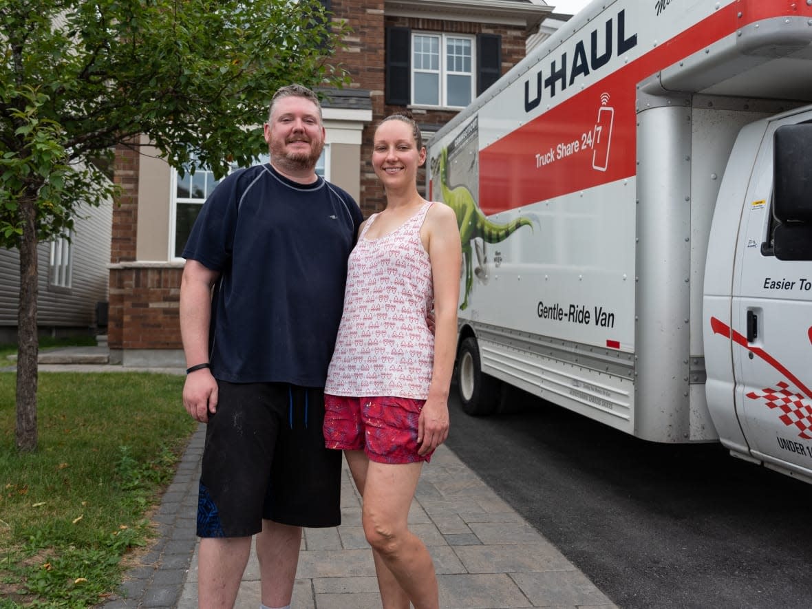 Robert and Natalie Hawkins are packing up their belongings to move out of their first house. Rapidly-changing market conditions forced them to sell for far less than they had hoped. (Alexander Behne/CBC - image credit)