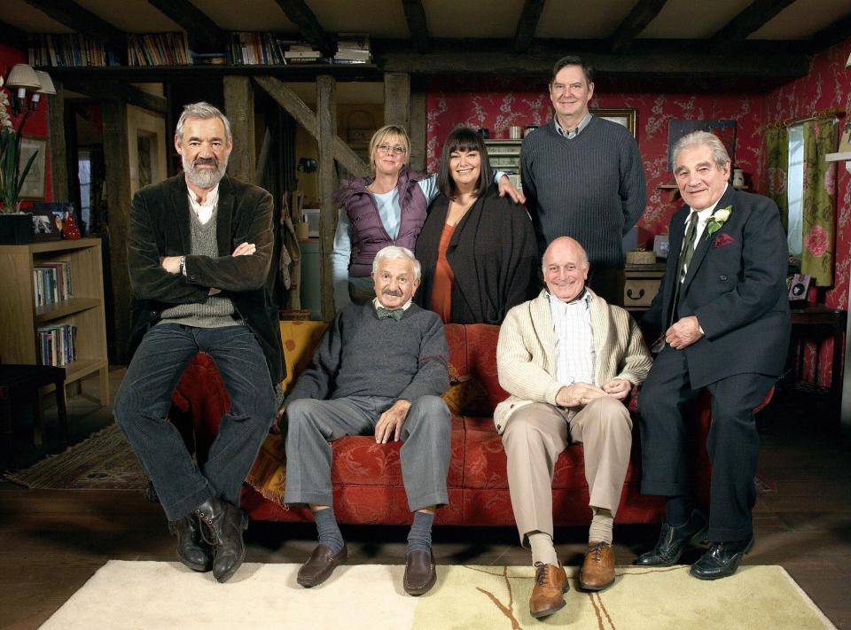 The Vicar of Dibley cast, l-r standing, Roger Lloyd Pack, Emma Chambers, Dawn French, James Fleet and Trott. On the sofa, John Bluthal and Gary Waldhorn - Television Stills