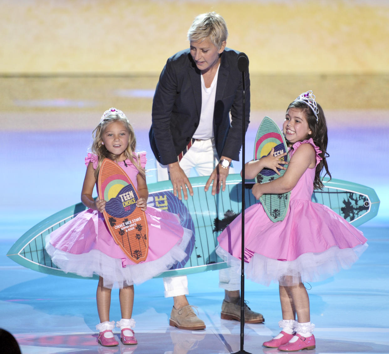 Image: Ellen DeGeneres, center, accepts the award for choice comedian onstage with Rosie Mcclelland, left, and Sophia Grace Brownlee at the Teen Choice Awards on  July 22, 2012, in Universal City, Calif. (John Shearer / AP)