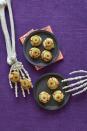 <p>Hey, we'd take these cheese puff eyeballs over peeled grapes as eyeballs any day — especially since they have a squirt of Sriracha. </p><p>Get the <a href="https://www.womansday.com/food-recipes/recipes/a60165/bitesize-eyeballs-recipe/" rel="nofollow noopener" target="_blank" data-ylk="slk:Bite-Size Eyeballs recipe;elm:context_link;itc:0;sec:content-canvas" class="link "><strong>Bite-Size Eyeballs recipe</strong></a> from Woman's Day. </p>