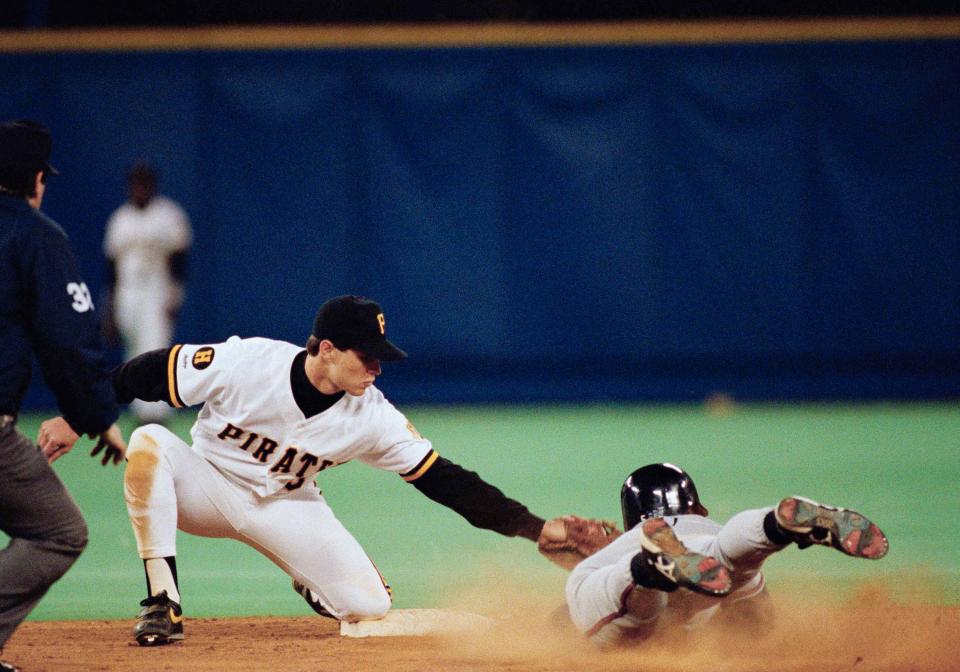 Pirates shortstop Jay Bell (left) tries to prevent Atlanta's Ron Gant from stealing second in Game 7 of the 1991 NLCS in Pittsburgh.
