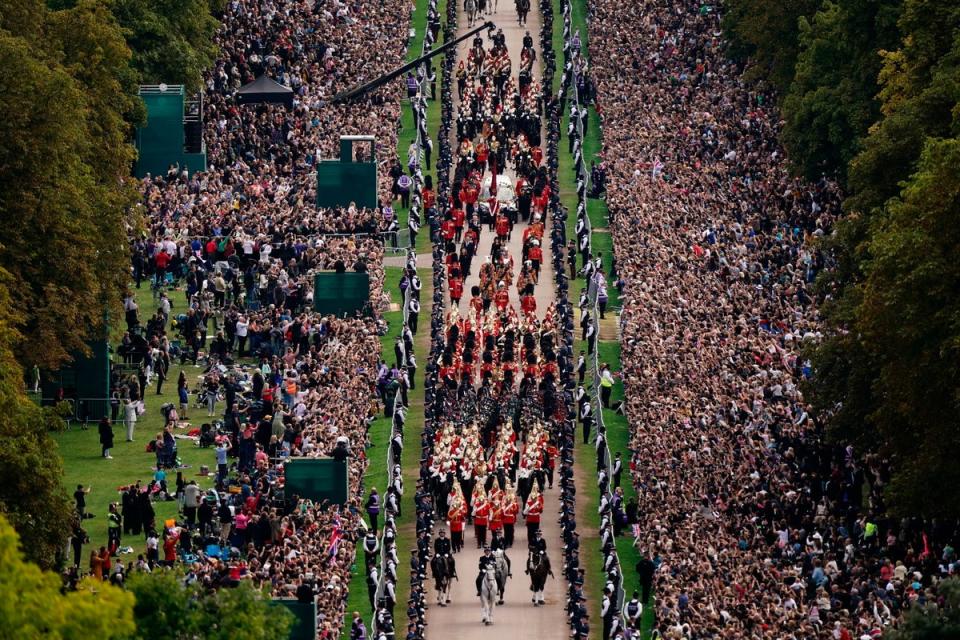 The procession travels down the Long Walk towards Windsor Castle (AP)