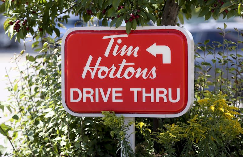 An August 2014 photo of a Tim Hortons drive thru sign in Toronto. Photo from Getty Images.