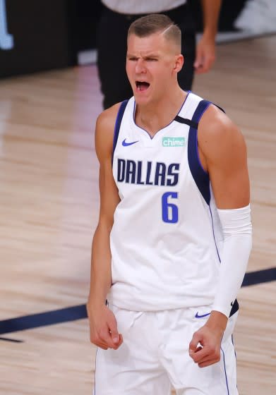 Dallas Mavericks' Kristaps Porzingis reacts to a call and receives a technical foul