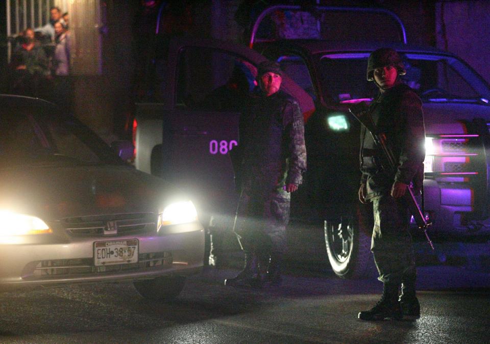 Soldiers from the Mexican army set up a checkpoint on a Juárez street in 2009.