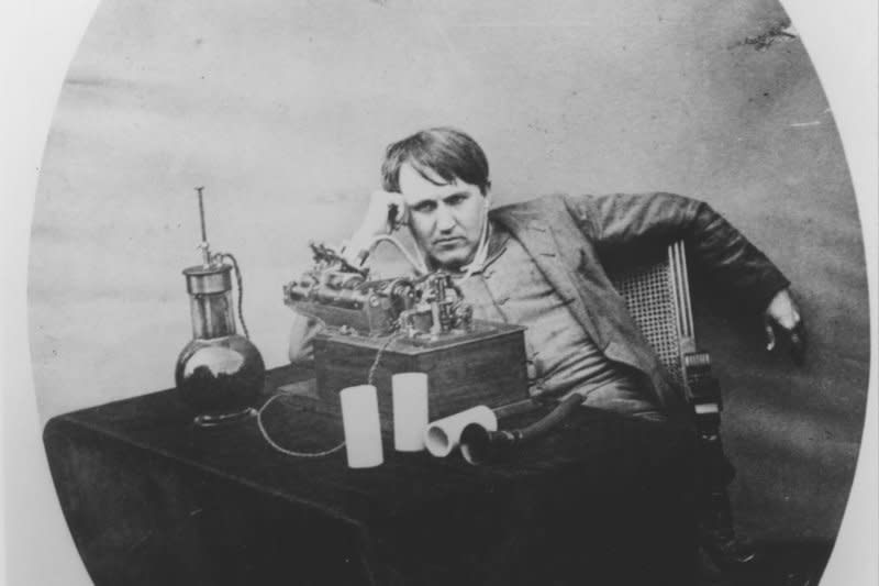 Thomas Edison poses in his laboratory in Orange, N.J., on June 16, 1888, with his first gramophone invention. On October 21, 1879, after 14 months of experiments, Edison invented the first practical electric incandescent lamp. UPI File Photo