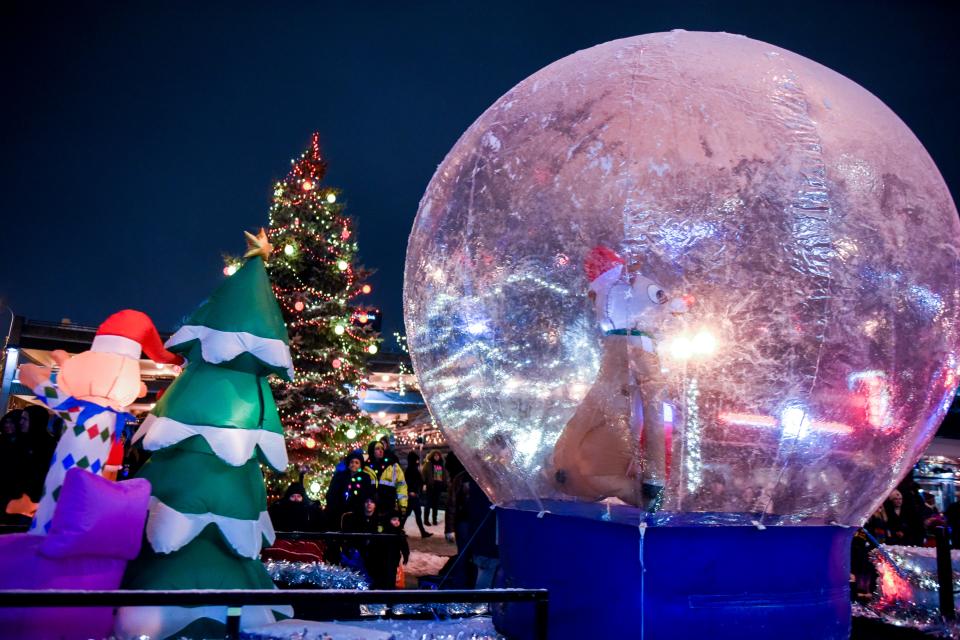 Parade floats drive by as people watch the 28th annual Parade of Lights on Friday, Nov. 29, 2019 in downtown Sioux Falls, S.D.