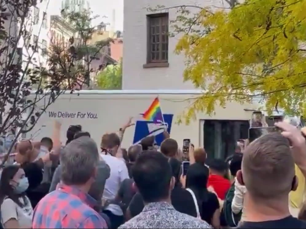 A crowd cheers for a United States Postal Service truck ((Cody Keenan - Twitter))