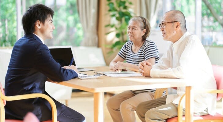 Asian couple buying life insurance