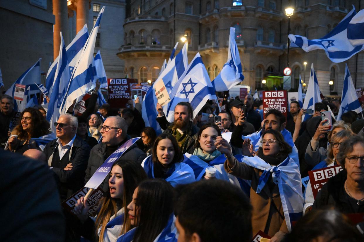 Crowds with placards gathered outside the BBC in central London (AFP)