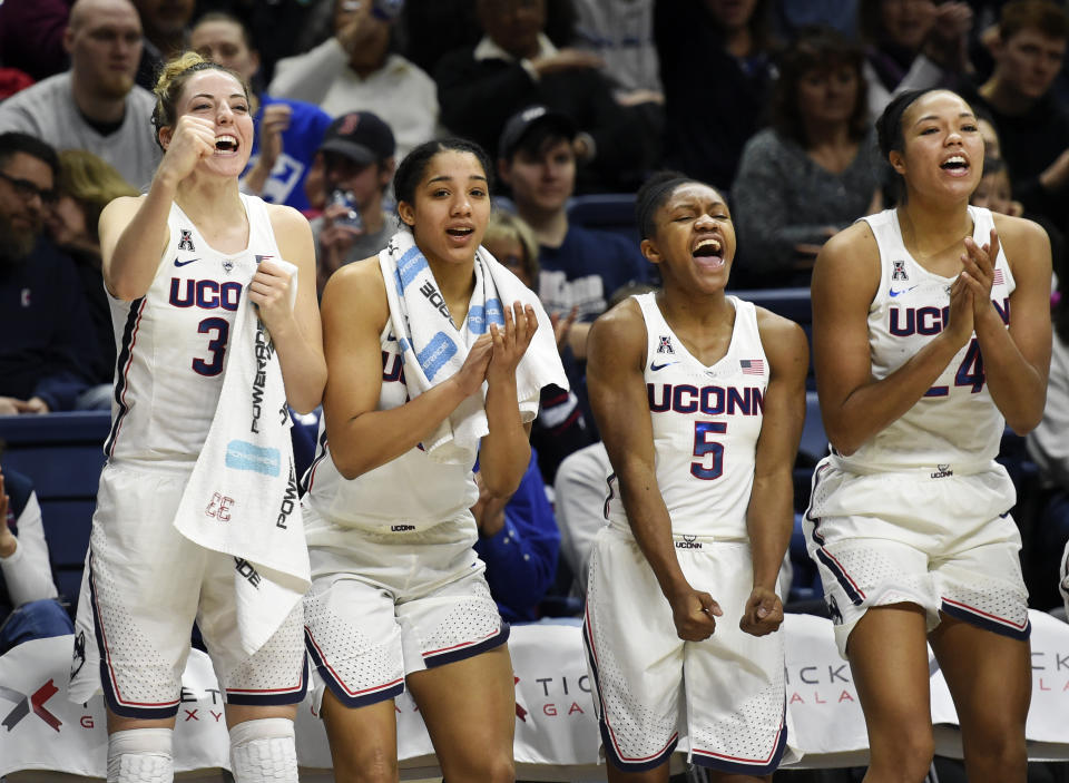 Connecticut’s Katie Lou Samuelson (33), Gabby Williams (15), Crystal Dangerfield (5), and Napheesa Collier (24) cheer from the bench in the closing seconds of an NCAA college basketball game against Tulane, Saturday, Jan. 27, 2018, in Storrs, Conn. UConn won, 98-45. (AP)