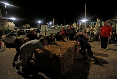 Farmers of FNSEA, France's largest farmers' union, block the Total biodiesel refinery at La Mede near Fos-sur-Mer, France June 10, 2018.REUTERS/Jean-Paul Pelissier