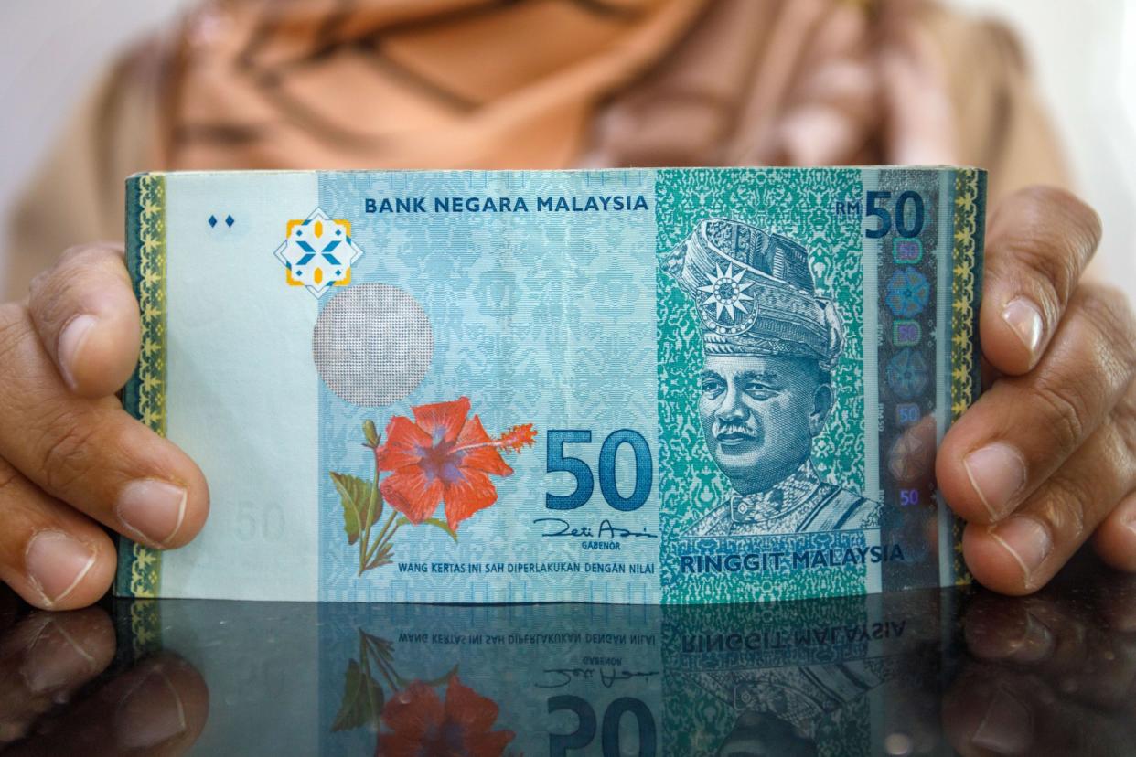 Malaysian fifty ringgit banknotes at a currency exchange store in Kuala Lumpur , Malaysia, on Thursday, Oct. 19, 2023. Photographer: Samsul Said/Bloomberg