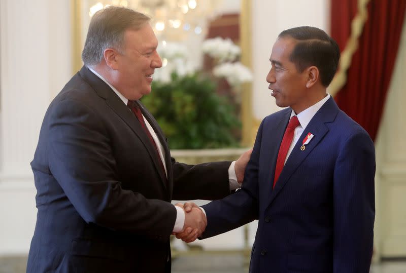 FILE PHOTO: Indonesia's President Widodo shakes hand with U.S. Secretary of State Pompeo before their meeting in Jakarta